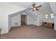 Spacious bonus room featuring high ceilings, ceiling fan and custom paint at 248 S 167Th Dr, Goodyear, AZ 85338