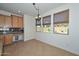 Dining room featuring a chandelier, large windows, and custom cabinets at 248 S 167Th Dr, Goodyear, AZ 85338