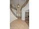Dramatic foyer with high ceilings, curved staircase, and elegant chandeliers at 248 S 167Th Dr, Goodyear, AZ 85338