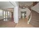 Stunning foyer with staircase, wrought iron railings, and elegant chandelier at 248 S 167Th Dr, Goodyear, AZ 85338