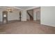 Inviting foyer showcases arched openings, elegant chandelier, and staircase at 248 S 167Th Dr, Goodyear, AZ 85338