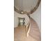 Elegant foyer with winding staircase, wrought iron details, and stunning chandeliers at 248 S 167Th Dr, Goodyear, AZ 85338
