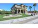 Beautifully landscaped front yard with mature trees and stone features enhancing curb appeal at 248 S 167Th Dr, Goodyear, AZ 85338