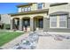 Inviting two-story home with tile entryway, stone accents, and covered front porch at 248 S 167Th Dr, Goodyear, AZ 85338