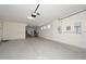 Spacious garage with ample room for parking and storage, plus room for a workshop at 248 S 167Th Dr, Goodyear, AZ 85338