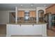 Kitchen featuring granite countertops, stainless steel appliances, and custom cabinets at 248 S 167Th Dr, Goodyear, AZ 85338