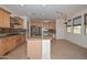 Spacious kitchen featuring an island, stainless steel appliances, and custom cabinets at 248 S 167Th Dr, Goodyear, AZ 85338