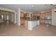 Gourmet kitchen with a central island, stainless steel appliances, and ample cabinet space at 248 S 167Th Dr, Goodyear, AZ 85338