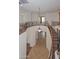 View of the landing and a curved staircase with decorative iron railings at 248 S 167Th Dr, Goodyear, AZ 85338