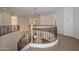 Second-floor landing featuring decorative iron railings and hanging pendant lights at 248 S 167Th Dr, Goodyear, AZ 85338