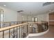 Second-floor landing showing curved staircases and wrought iron railings at 248 S 167Th Dr, Goodyear, AZ 85338