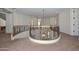 View of the upstairs landing, curved staircase and decorative iron railings at 248 S 167Th Dr, Goodyear, AZ 85338