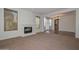 Living room with cozy fireplace, lots of natural light, and direct access to kitchen at 248 S 167Th Dr, Goodyear, AZ 85338