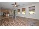 Large open living space with backyard access and a glimpse into the well-appointed kitchen at 248 S 167Th Dr, Goodyear, AZ 85338