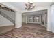 Spacious living room with fireplace, staircase, and an open floor plan at 248 S 167Th Dr, Goodyear, AZ 85338