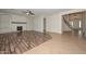 Open-concept living space featuring a fireplace and wood-look flooring at 248 S 167Th Dr, Goodyear, AZ 85338