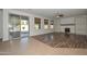 Spacious living room with patio access and a cozy fireplace, perfect for entertaining at 248 S 167Th Dr, Goodyear, AZ 85338