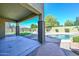 Covered patio with view of the backyard and pool, providing a perfect space for outdoor gatherings at 248 S 167Th Dr, Goodyear, AZ 85338