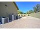 The backyard has a pool surrounded by lush landscaping and brick pavers at 248 S 167Th Dr, Goodyear, AZ 85338