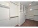 Walk-in closet with custom built-in shelving, drawers, and plenty of storage space at 248 S 167Th Dr, Goodyear, AZ 85338