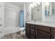 Bathroom features white tile shower and dark wood vanity at 2511 W Queen Creek Rd # 262, Chandler, AZ 85248