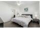 Bedroom featuring white walls, bedside tables, and lamps at 2511 W Queen Creek Rd # 262, Chandler, AZ 85248