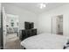 Clean bedroom with TV, ceiling fan, and access to living area at 2511 W Queen Creek Rd # 262, Chandler, AZ 85248