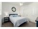 Comfortable bedroom with a decorative mirror above the bed and matching lamps on each side at 2511 W Queen Creek Rd # 262, Chandler, AZ 85248