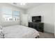 Bedroom features a ceiling fan and window at 2511 W Queen Creek Rd # 262, Chandler, AZ 85248