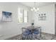Bright dining area features modern lighting, stylish decor, and large windows that provide natural light and a welcoming atmosphere at 2511 W Queen Creek Rd # 262, Chandler, AZ 85248