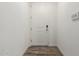 Contemporary entryway with wood floors and a white door at 2511 W Queen Creek Rd # 262, Chandler, AZ 85248