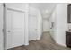 Bright hallway featuring gray floors, white walls, and neutral decor at 2511 W Queen Creek Rd # 262, Chandler, AZ 85248