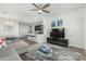 Bright living room with a ceiling fan, modern decor, and open access to the kitchen area at 2511 W Queen Creek Rd # 262, Chandler, AZ 85248