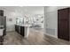 Open-concept living space seamlessly connects the kitchen and living areas, ideal for entertaining and modern living at 2511 W Queen Creek Rd # 262, Chandler, AZ 85248