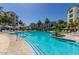 Luxury community pool with ample seating and lush landscaping; perfect for relaxation at 2511 W Queen Creek Rd # 262, Chandler, AZ 85248