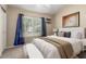 Sunlit bedroom showcasing a large window and a serene atmosphere for ultimate relaxation at 2753 E Kenwood St, Mesa, AZ 85213