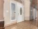 Foyer showcasing a decorative front door and tile flooring at 2753 E Kenwood St, Mesa, AZ 85213