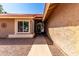 Inviting front entry with a decorative door and manicured landscaping at 2753 E Kenwood St, Mesa, AZ 85213