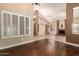 Open concept living room with wood and tile flooring, a fireplace, and natural light at 2753 E Kenwood St, Mesa, AZ 85213