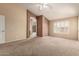 Spacious main bedroom with vaulted ceiling, neutral carpet, and an ensuite bathroom at 2753 E Kenwood St, Mesa, AZ 85213