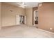 Main bedroom featuring neutral carpet, a ceiling fan, and ensuite bathroom access at 2753 E Kenwood St, Mesa, AZ 85213
