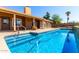 Stunning backyard pool with a home featuring a covered patio, offering a perfect blend of indoor-outdoor living at 2753 E Kenwood St, Mesa, AZ 85213