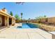 Inviting backyard pool with custom stacked stone accents, perfect for outdoor entertaining and relaxation at 2753 E Kenwood St, Mesa, AZ 85213