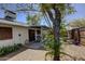 Backyard features covered patio, rock landscape and shade trees at 3106 W Mohawk Ln, Phoenix, AZ 85027