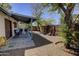 Serene backyard with covered patio, mature trees and landscape, perfect for relaxing at 3106 W Mohawk Ln, Phoenix, AZ 85027