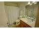 Neutral bathroom features white fixtures, tile floor, and an updated vanity at 3106 W Mohawk Ln, Phoenix, AZ 85027