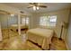 Cozy bedroom features wood floors, mirrored closet and natural light from the window at 3106 W Mohawk Ln, Phoenix, AZ 85027