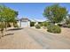 A charming single-story house featuring a long driveway leading up to a one car garage at 3106 W Mohawk Ln, Phoenix, AZ 85027