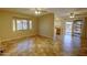 Bright living room showcasing neutral walls, tile floors, ceiling fans, and natural light at 3106 W Mohawk Ln, Phoenix, AZ 85027