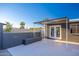 Back patio featuring bench seating, modern tiling, and access to the house through french doors at 3231 W Willow Ave, Phoenix, AZ 85029